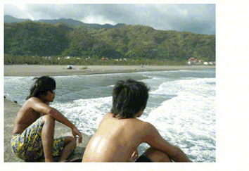 two-surfers-looking-at-ocean-waves-at-the-blue-ocean-surfing-club-toucheng-yilan-taiwan