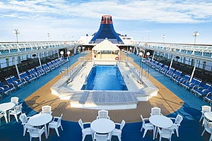 Top Deck Pool of Star Cruise Ship, Surrounded by White Tables & Chairs
